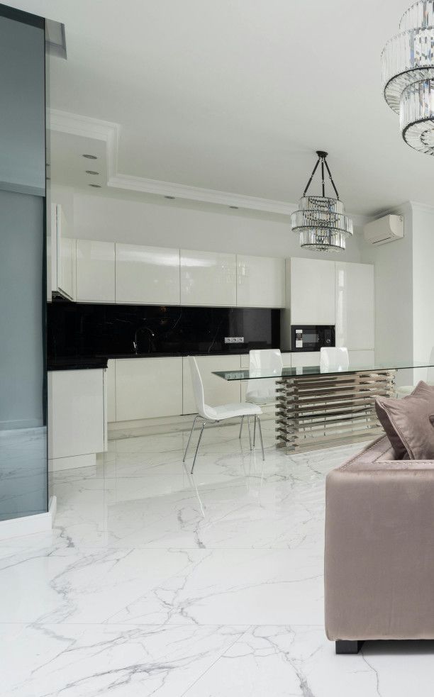 Swansea kitchen with a luxury marble tiled floor by Daffodil Tiling.